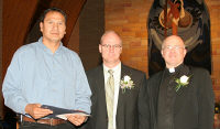 Mike received St. Joseph's Indian School's 2008 Distinguished Alumni Award from Mike, Executive Director of Child Services and Fr. Steve.