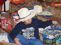 Devin wears his new hat while opening the rest of his gifts!