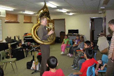 Lakota students learning about brass instruments.