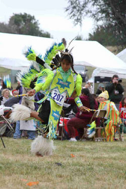 Daniel dancing the Fancy dance at St. Joseph's annual powwow.