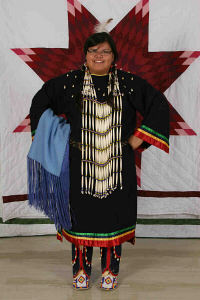 Matt wearing his Traditional Dance regalia for St. Joseph's Indian School's powwow.