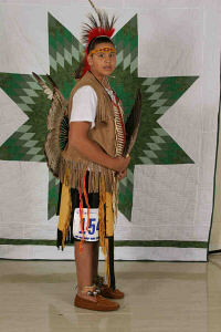 Janet wearing her Traditional Dance regalia for St. Joseph's Indian School's powwow.