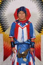 Jarrod wearing his Grass Dance regalia for St. Joseph's Indian School's powwow.