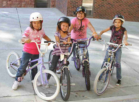 Lakota girls love riding their bikes around St. Joseph's campus.
