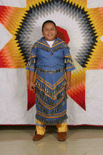 Tonya wearing her Jingle Dance regalia for St. Joseph's Indian School's powwow.