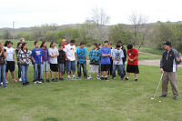 Students learn the basic elements of golf from the pro.
