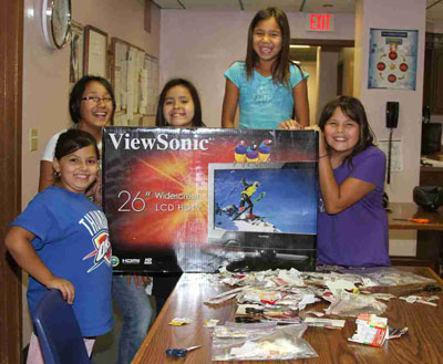Lakota students show off their new tv from clipping box tops