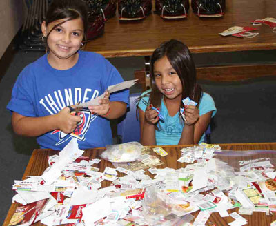 Lakota students at St. Joseph's clipping box tops.