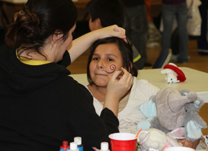 Native American student getting her face painted.